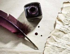 letter with ink and purple feather